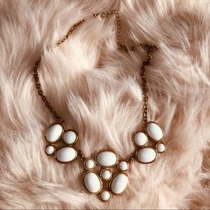 Gold necklace with white marble